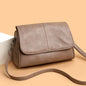 Brown retro oil wax leather crossbody bag with textured vintage look, simple flap design, and adjustable shoulder strap.