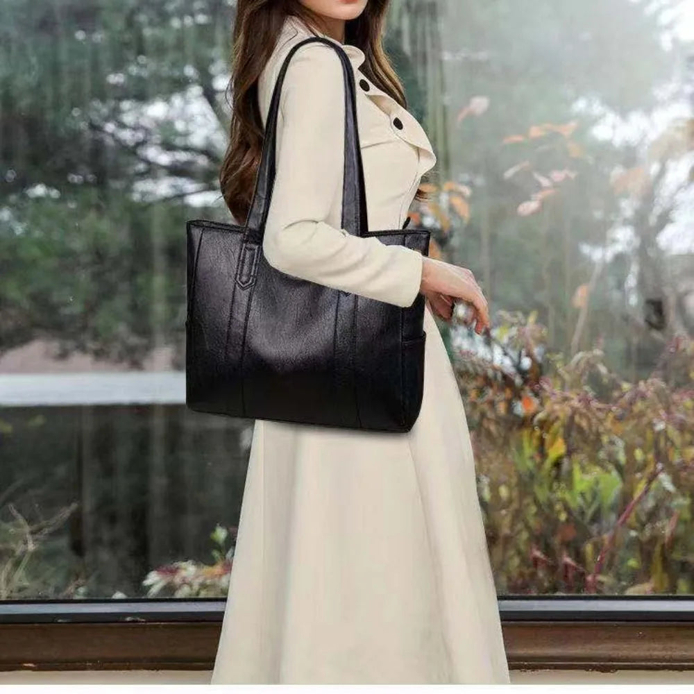 Brown leather tote bag for women, large shoulder handbag with spacious interior and stylish design.