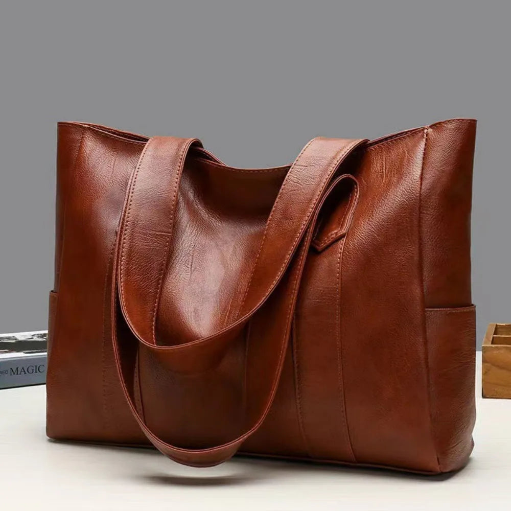 Brown leather tote bag for women, large shoulder handbag with sturdy handles, stylish and functional for daily use.