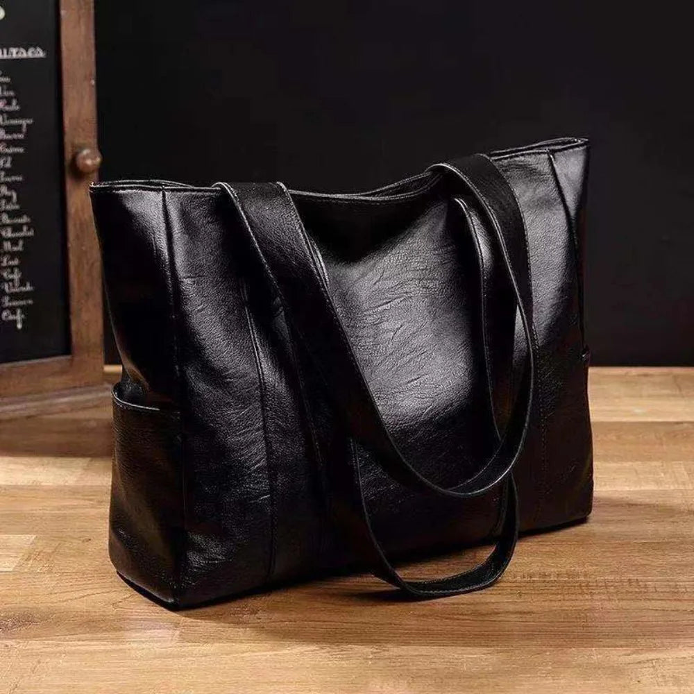 Brown leather tote bag for women, large shoulder handbag with spacious interior, stylish and versatile accessory.