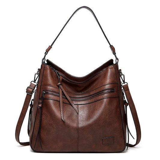 Elegant burgundy women’s leather designer shoulder handbag with large size, suitable for travel, weekend, outdoor, and winter use.