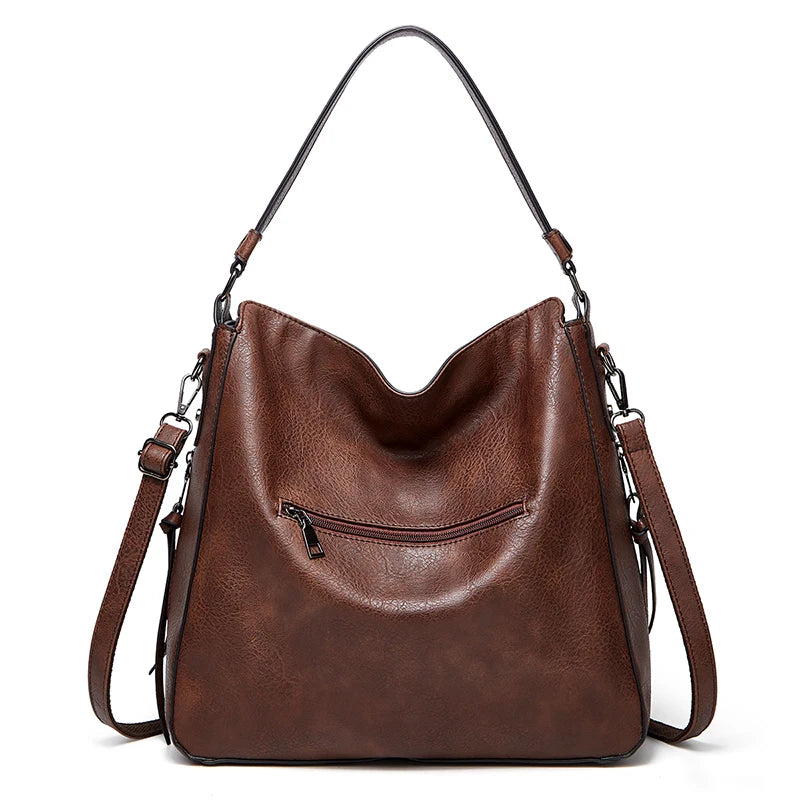 Elegant burgundy leather women’s handbag with shoulder strap, large designer travel and outdoor messenger bag for winter.