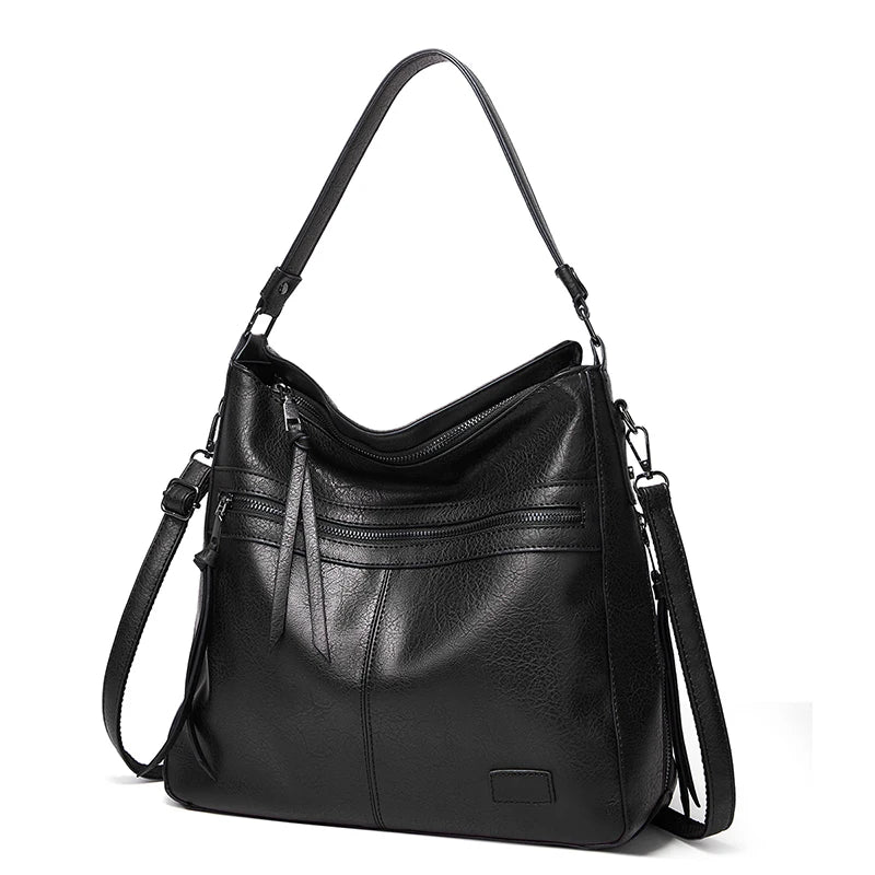 Elegant burgundy leather women’s designer shoulder handbag with large size, perfect for travel, weekend outings, and outdoor use.