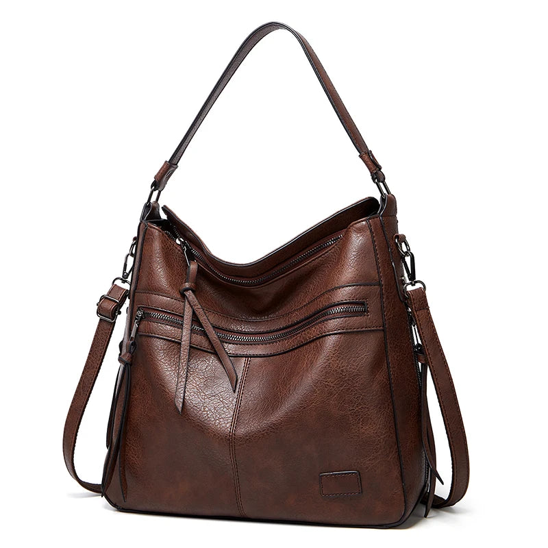 Women’s burgundy leather designer shoulder handbag with large messenger style, ideal for travel, weekend, and outdoor use.