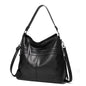 Women’s burgundy leather shoulder handbag, large designer travel and outdoor messenger bag with feminine style and spacious interior.
