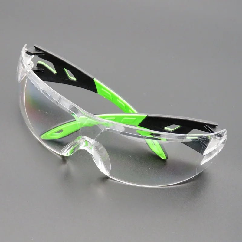 Unisex industrial safety goggles with anti-splash, windproof, and dustproof protection, designed for work and cycling safety.