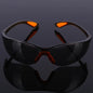 Unisex industrial safety goggles with anti-splash, dustproof, windproof design for cycling and work eye protection.
