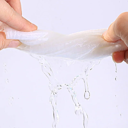 Mini compressed towel capsules by BACKUPMYFILESNOW.COM®, portable face care wipes for outdoor travel and quick cleaning.
