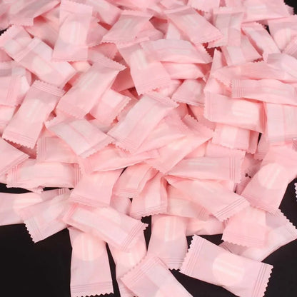 Mini compressed towel capsules by BACKUPMYFILESNOW.COM®, portable disposable cloths for face care, travel, outdoor use, and wipes.