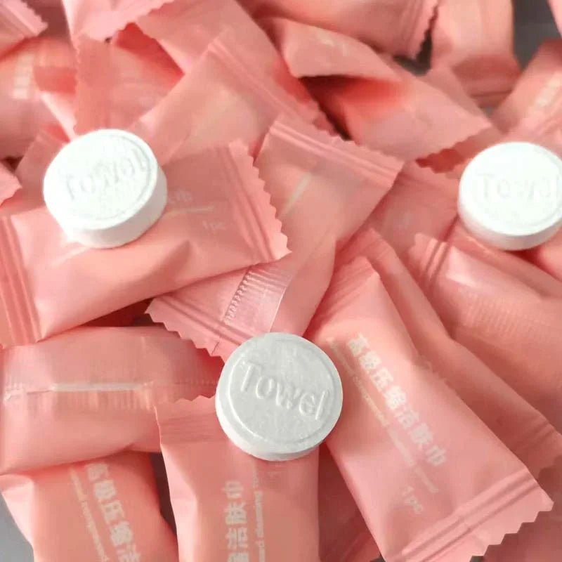 Mini compressed towel capsules by BACKUPMYFILESNOW.COM® for face care, travel, and outdoor use, includes 20 to 100 disposable cloth wipes.