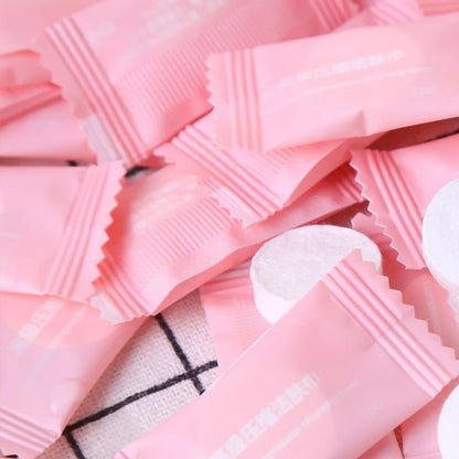 Mini compressed towel capsules by BACKUPMYFILESNOW.COM, disposable face care cloths for outdoor travel and quick refreshment.