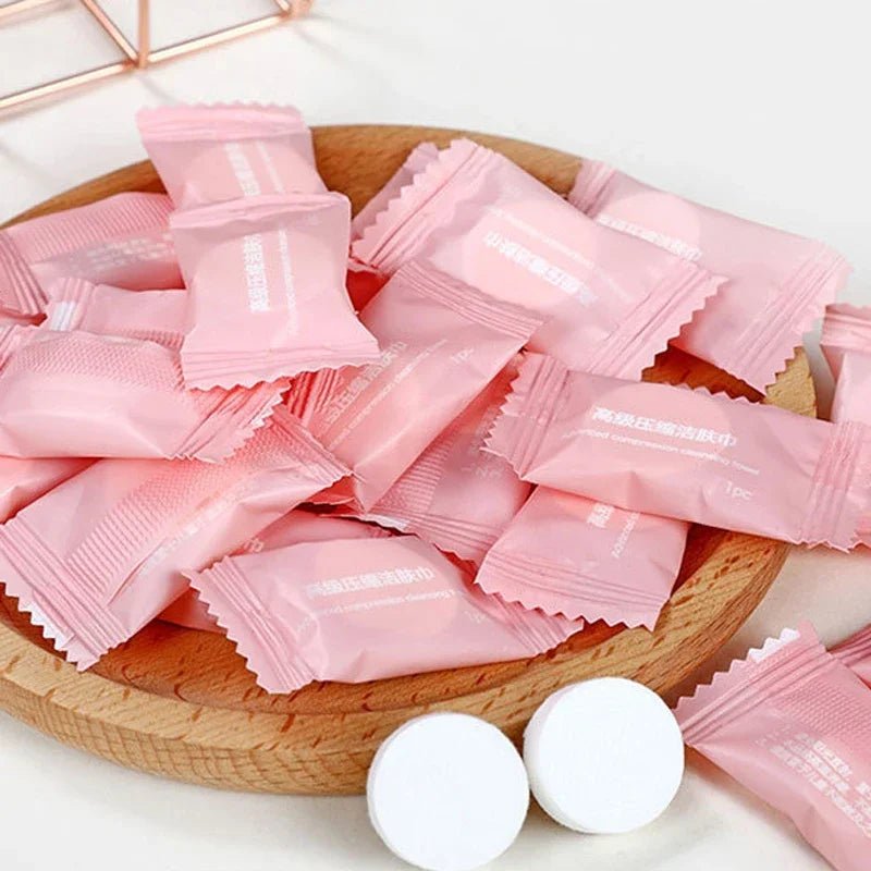 Mini compressed towel capsules by BACKUPMYFILESNOW.COM® for face care, travel, outdoor use, with disposable cloth wipes and tissues.
