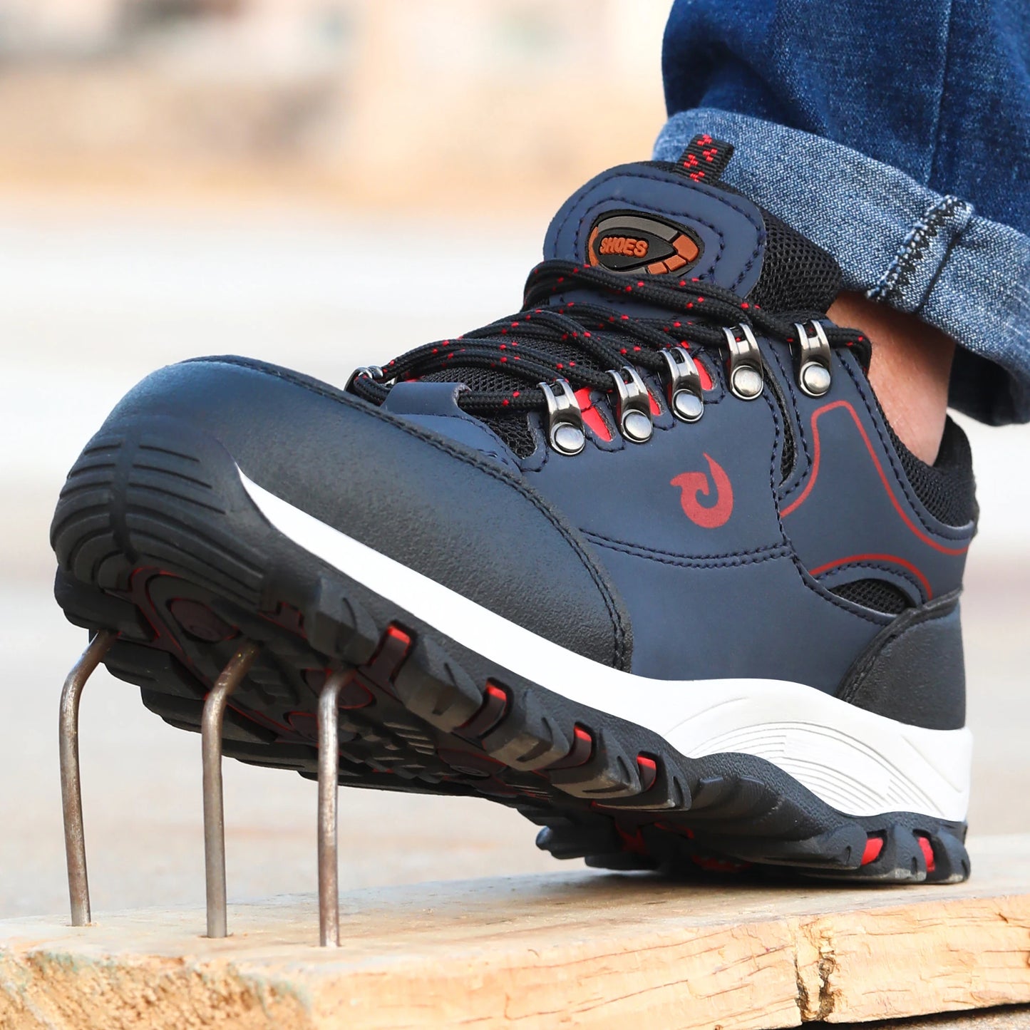 Blue steel toe cap work boots for men, puncture-proof safety shoes with protective features and sturdy male work footwear.