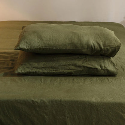 4-piece linen bed sheet set with flat sheet, deep pocket fitted sheet, and pillowcases in natural flax color.