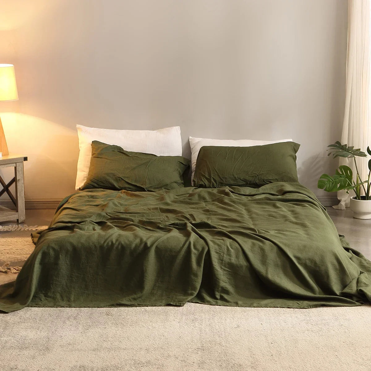 4-piece linen bed sheet set with flat sheet, fitted sheet with deep pockets, and pillowcases in natural flax color.