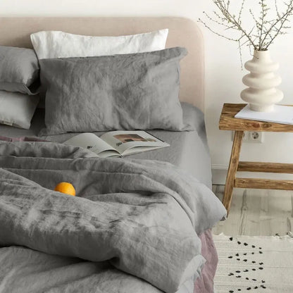 BackupMyFilesNow® 4-piece linen bed sheet set with flat sheet, deep pocket fitted sheet, and two pillowcases in flax color.