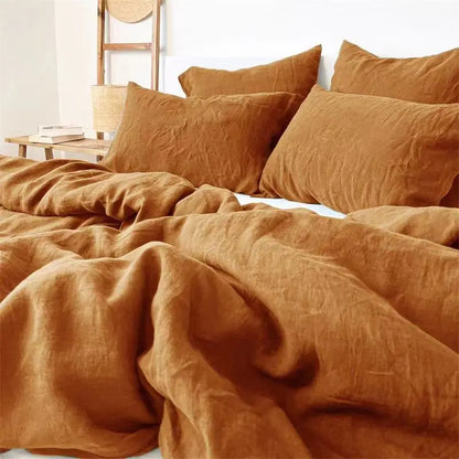 4-piece linen bed sheet set with flat sheet, fitted sheet with deep pockets, and pillowcases in natural flax color.