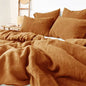 4-piece linen bed sheet set with flat sheet, fitted sheet with deep pockets, and pillowcases in natural flax color.