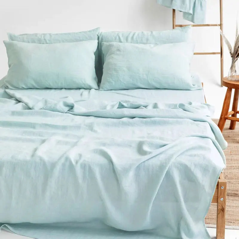 4-piece linen bed sheet set with flat sheet, deep pocket fitted sheet, and two pillowcases in natural flax color, by BACKUPMYFILESNOW.COM®.