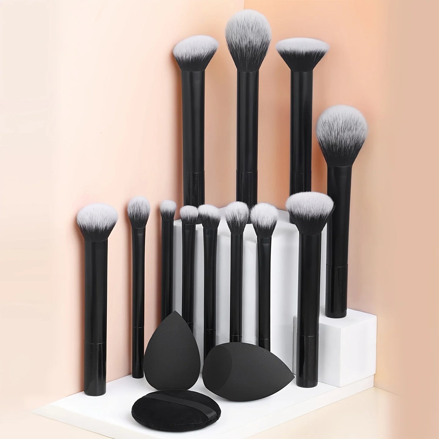 12-piece BackupMyFilesNow.com makeup brush set with angled and teardrop blenders, including powder puff for professional makeup application.