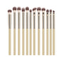12-piece eyeshadow makeup brush set with soft synthetic hair including blending, shader, angled, and liner brushes for eye makeup.
