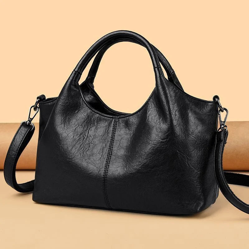 Fashionable large capacity ladies' soft PU leather handbag with shoulder strap, crossbody style, zipper closure, multifunctional design.