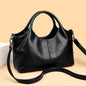 Fashionable large capacity ladies soft PU leather handbag with shoulder strap, zipper closure, and multifunctional design.