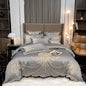 White and gray satin cotton bedding set with gold embroidery, including fitted sheet, pillowcases, and comforter cover for king or queen beds.