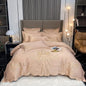 White and gray satin cotton bedding set with gold embroidery, including fitted sheet, pillowcases, and comforter cover for king or queen size.