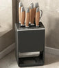 Grey kitchen accessories organizer with wall-mounted knife rack and drainable carbon steel holder for safe, convenient knife storage.