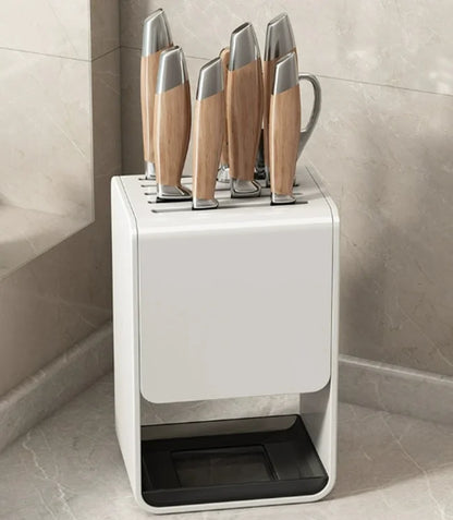 Gray kitchen accessories organizer with wall-mounted carbon steel knife rack and drainable stand for safe knife storage.