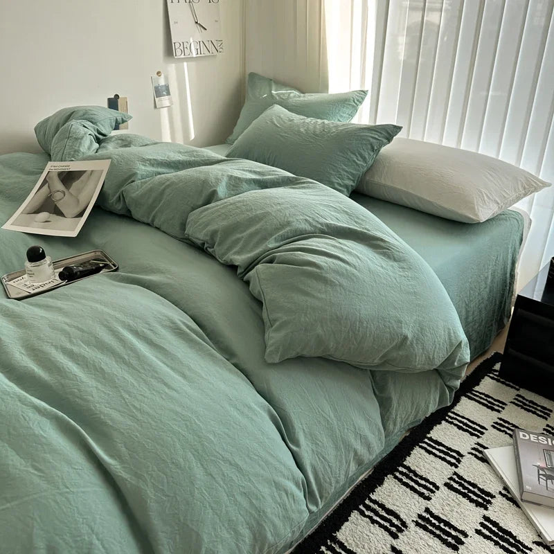 Dark blue solid cotton bedding set with duvet cover and pillowcases, king size, designed for single, double, or queen beds.