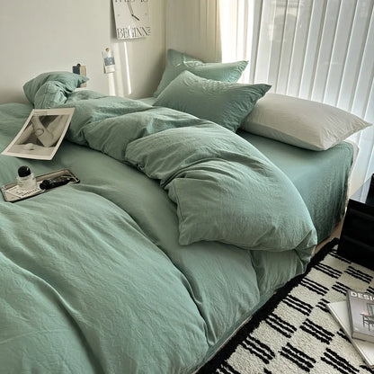 Dark blue solid cotton bedding set with duvet cover and pillowcases, king size, designed for single, double, or queen beds.