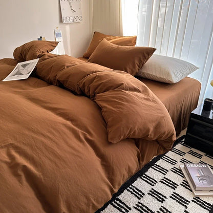 Dark blue king-size cotton bedding set with sheet, duvet cover, and pillowcases, featuring a solid design for singles or couples.