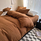 Dark blue king-size cotton bedding set with sheet, duvet cover, and pillowcases, featuring a solid design for singles or couples.