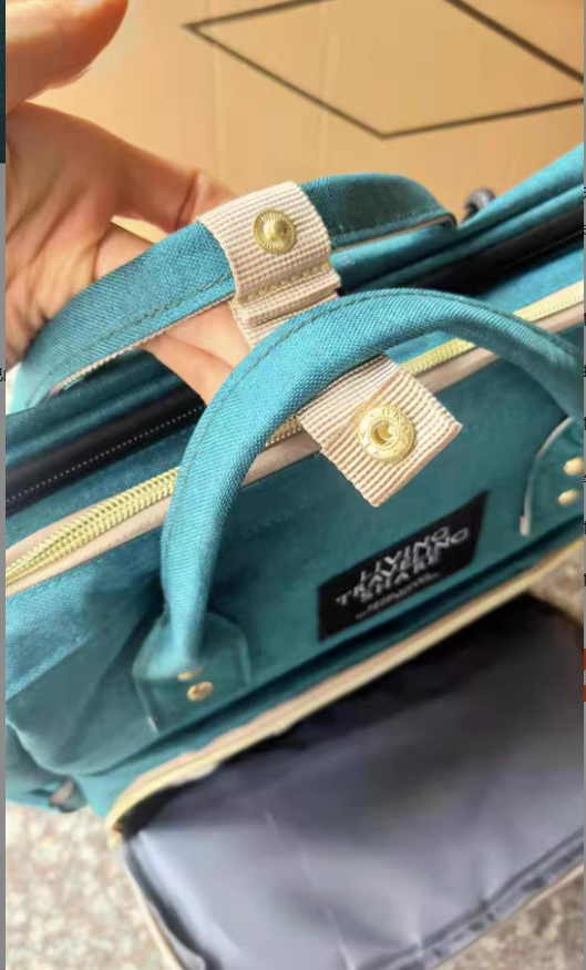 Dark blue large-capacity mommy bag by BackupMyFilesNow.com with multiple compartments and adjustable straps for moms on the go.