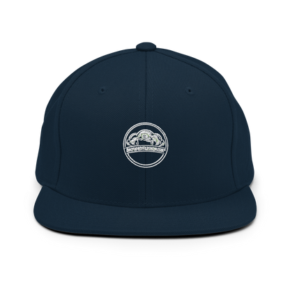 Dark navy Classic Snapback cap by Yupoong 6089M with flat brim and adjustable strap, featuring embroidered design.