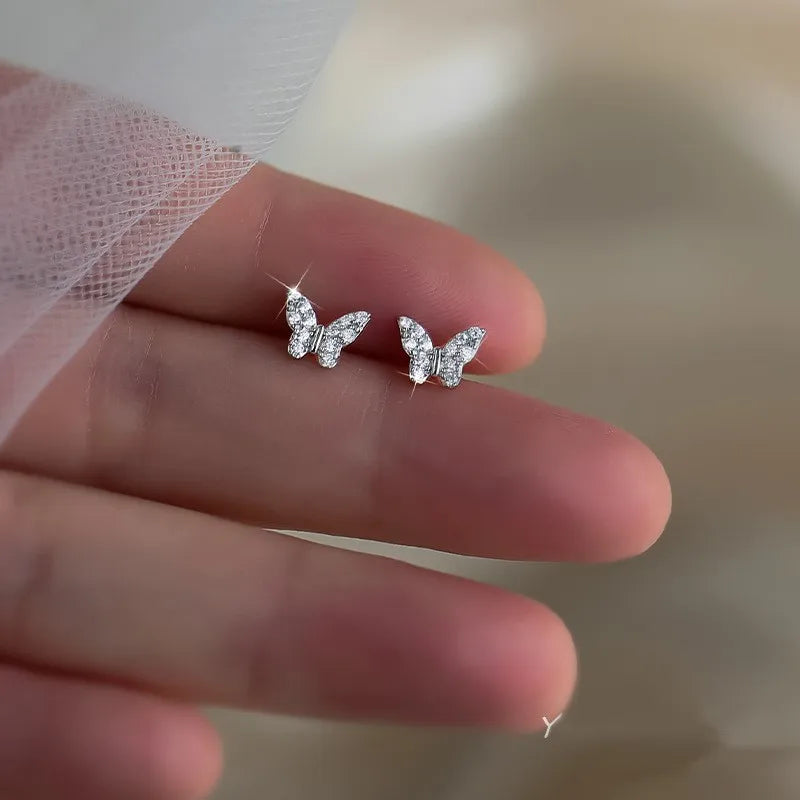 Silver butterfly stud earrings for women, delicate jewelry with butterfly design, ideal for girls and gifting.