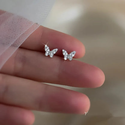Silver butterfly stud earrings for women, delicate jewelry with butterfly design, ideal for girls and gifting.