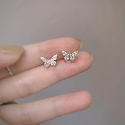 Silver butterfly stud earrings for women, delicate jewelry by ANENJERY, perfect for girls and gift-giving.
