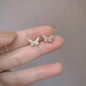 Silver butterfly stud earrings for women, delicate jewelry by ANENJERY, perfect for girls and gift-giving.
