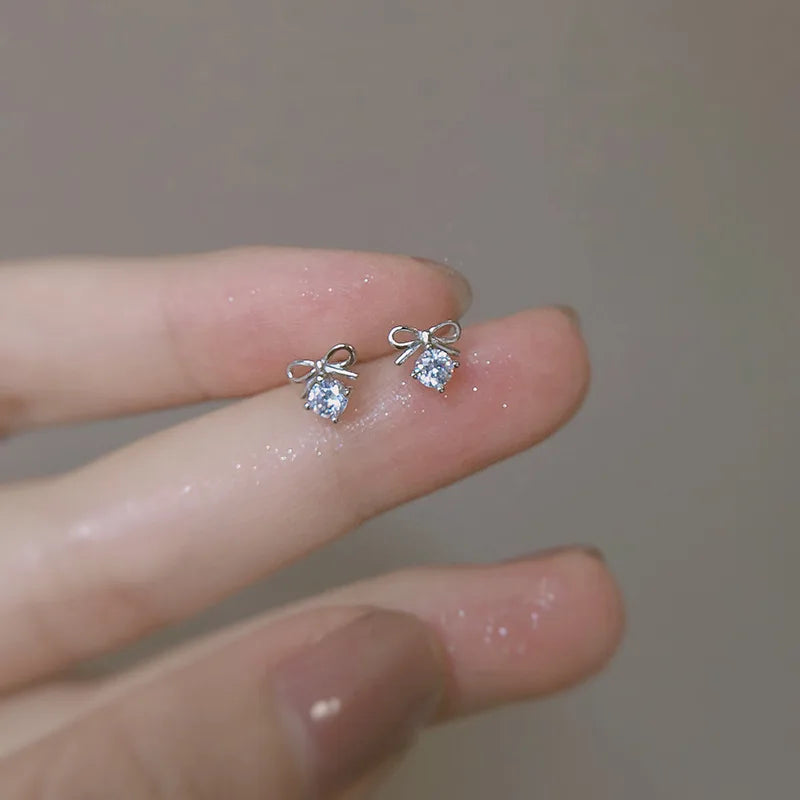 Silver ANENJERY butterfly stud earrings for women, featuring delicate and cute butterfly designs, perfect for girls and gift-giving.
