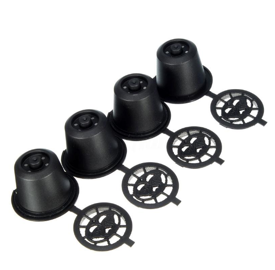 Set of four reusable coffee capsules with a matching coffee spoon, ideal for eco-friendly brewing.