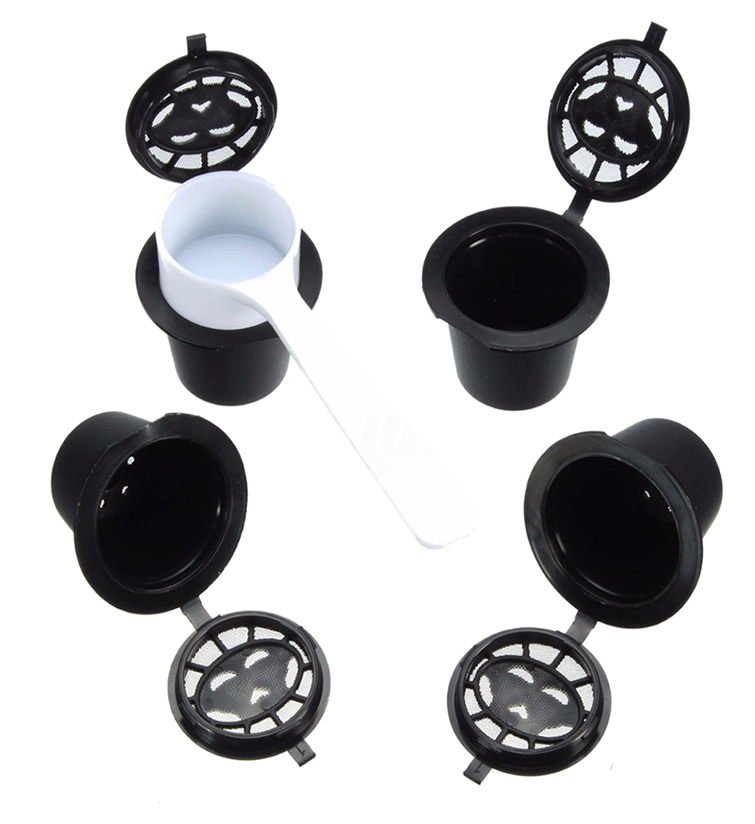 Set of four reusable coffee capsules with a coffee spoon, durable stainless steel design for eco-friendly brewing.