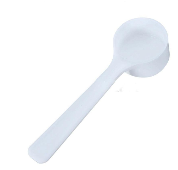 Set of four reusable coffee capsules with a coffee spoon, compact and eco-friendly for use with coffee machines.