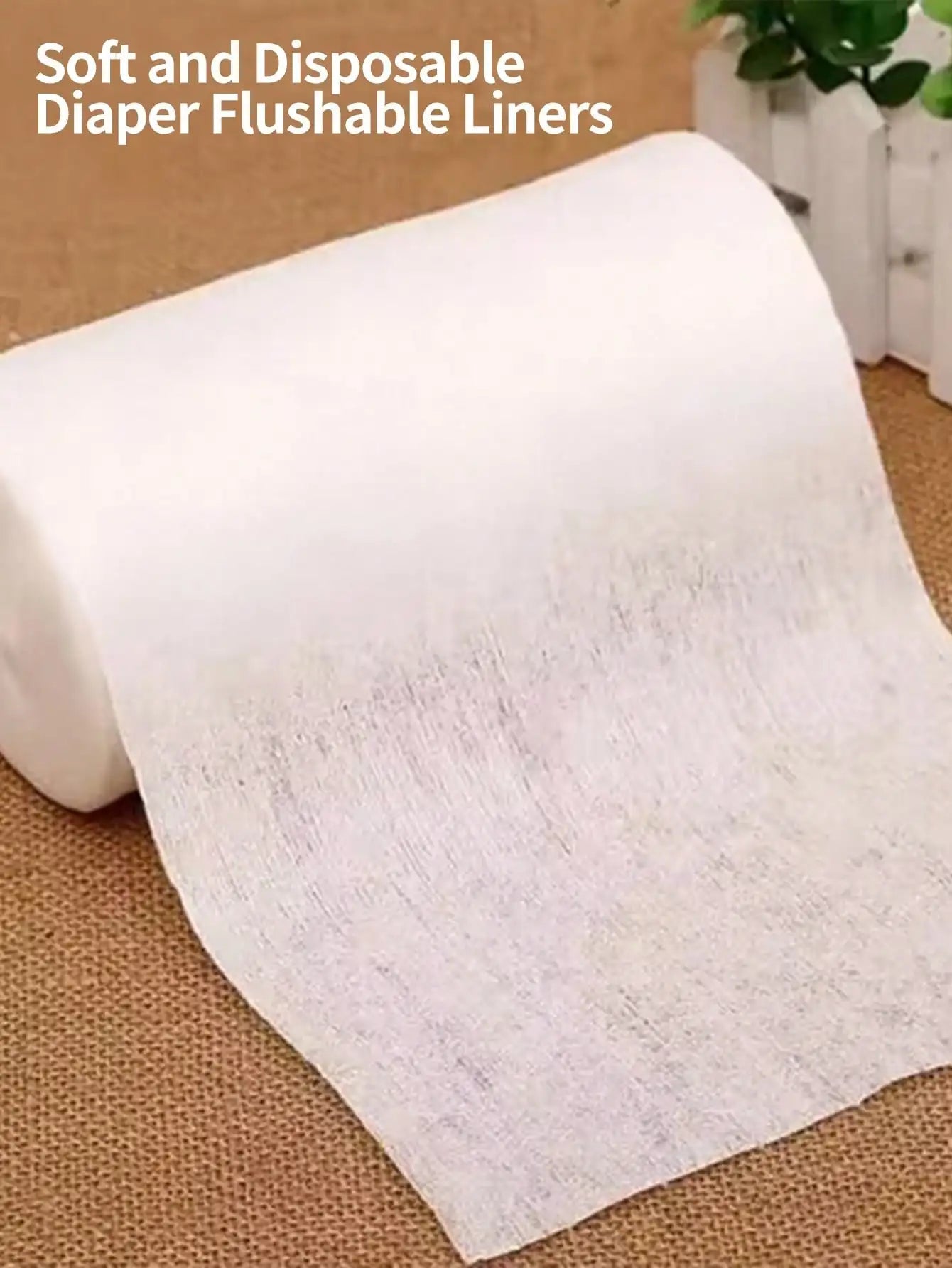 Two rolls of biodegradable viscose flushable diaper liners by BACKUPMYFILESNOW.COM®, each with 100 sheets for cloth diapering.