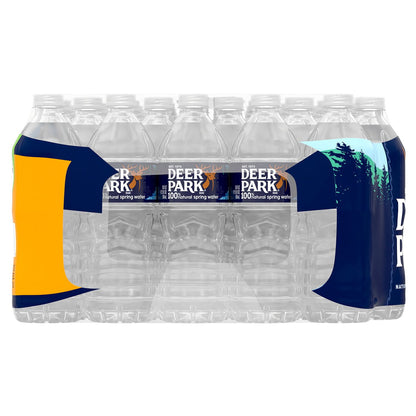 Four bottles of DEER PARK 100% Natural Spring Water, 16.9 fl oz each, with clear labels and blue caps.