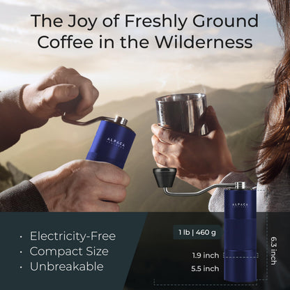 Blue stainless steel conical burr manual coffee grinder with ergonomic handle for fresh coffee grinding.