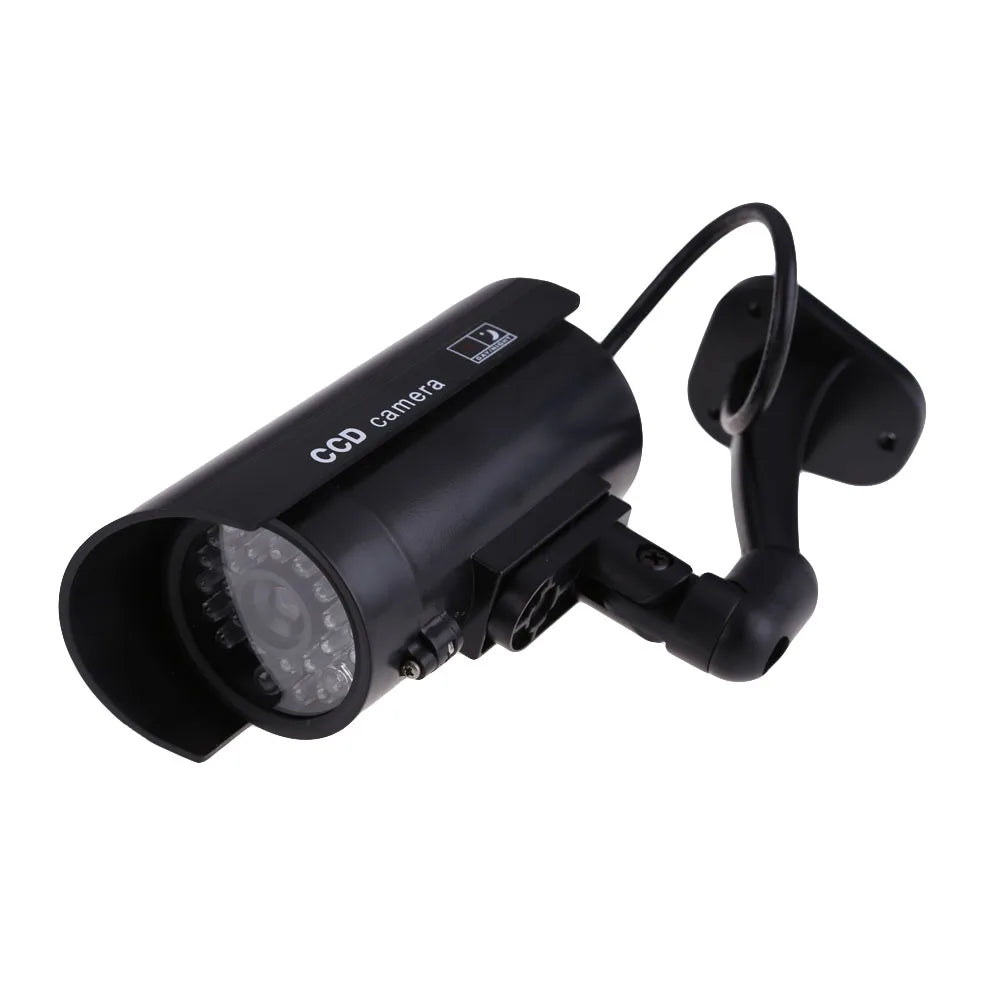 Fake security camera with blinking LED light for theft prevention, suitable for outdoor and indoor surveillance.
