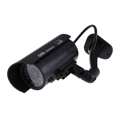 Fake security camera with blinking LED light for theft prevention, suitable for outdoor and indoor surveillance.